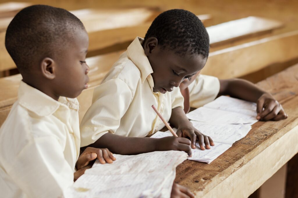 African children learning together in a classroom. Image by magnific via Magnific.